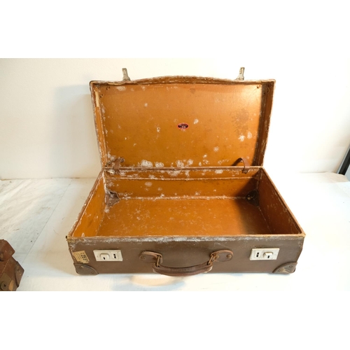 356 - Two vintage leather suitcases.