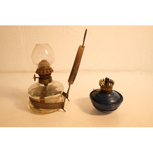 363 - A vintage blue enamel pixie oil lamp and another.