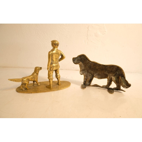 380 - A vintage brass ornament of a man and his dog and another dog.