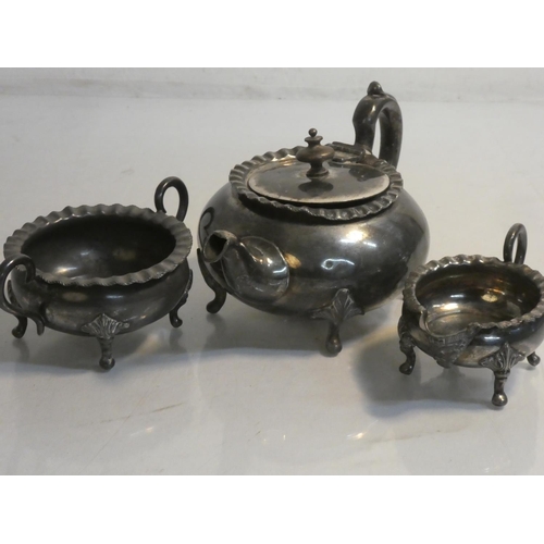 432 - A three piece metal tea service.