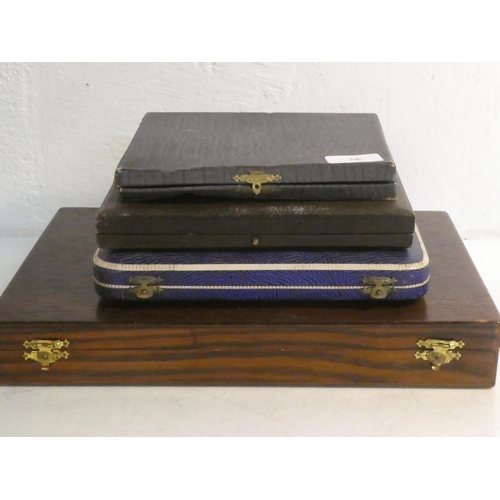 454 - A vintage oak cutlery box, a cased Frederick J Malcom Ltd, Belfast EPNS lobster cutlery set,