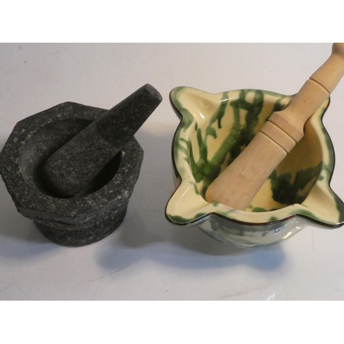 455 - A ceramic pestle and mortar and another.