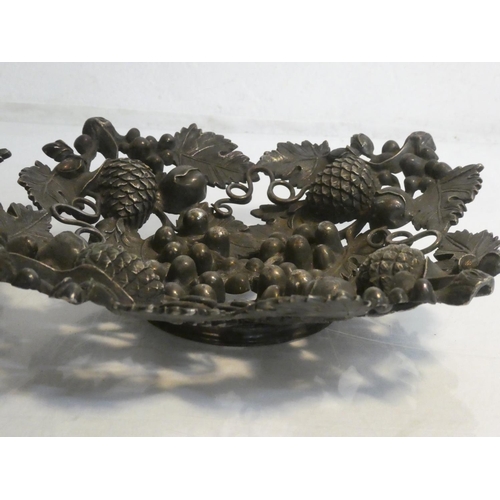 468 - A pair of metal dishes decorated with fruits.