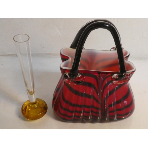 506 - A decorative glass ornamental bag vase, measuring 25cm and a vintage glass bud vase,