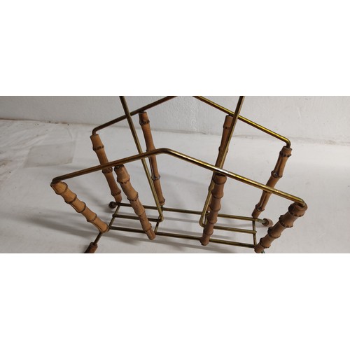 121 - A vintage bamboo and brass magazine rack, measuring 42cm.