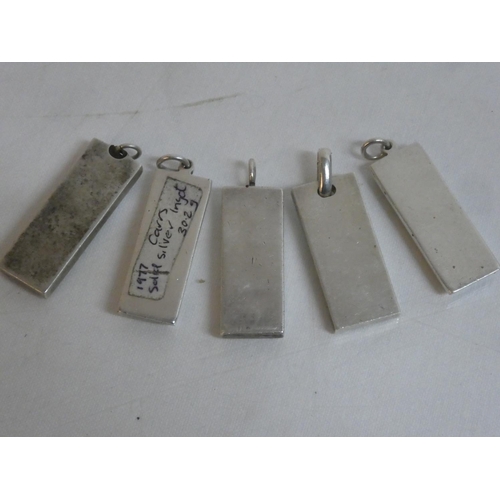 493 - Five Sterling Silver ingots, weighing 153g.