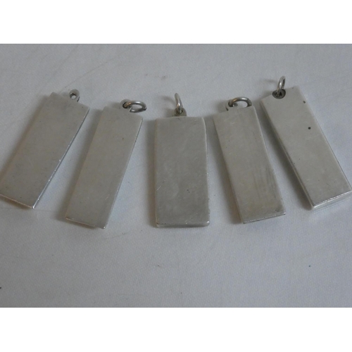 494 - Five Sterling Silver ingots, weighing 151g.