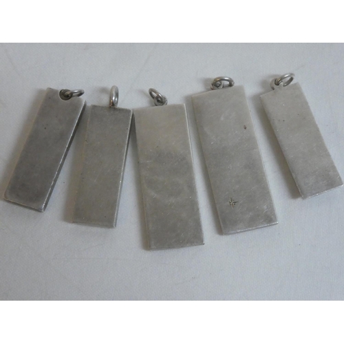 495 - Five Sterling Silver ingots, weighing 153g.