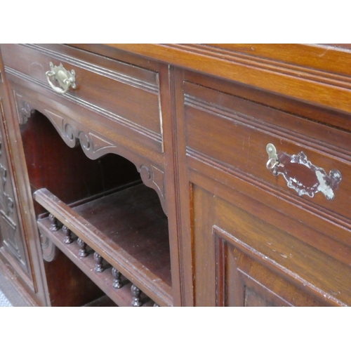 154 - An antique mahogany sideboard with mirror back.