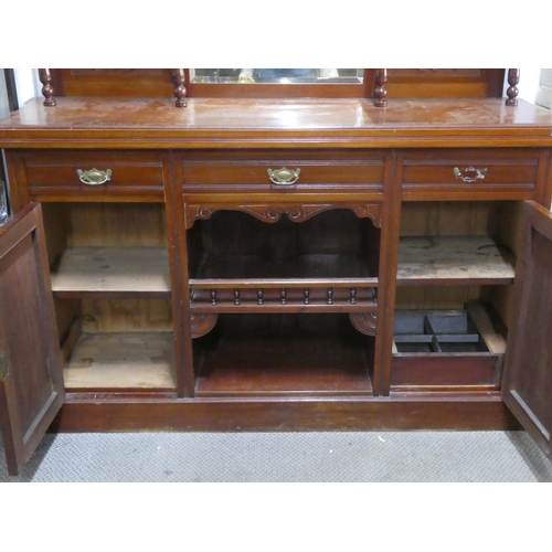 154 - An antique mahogany sideboard with mirror back.