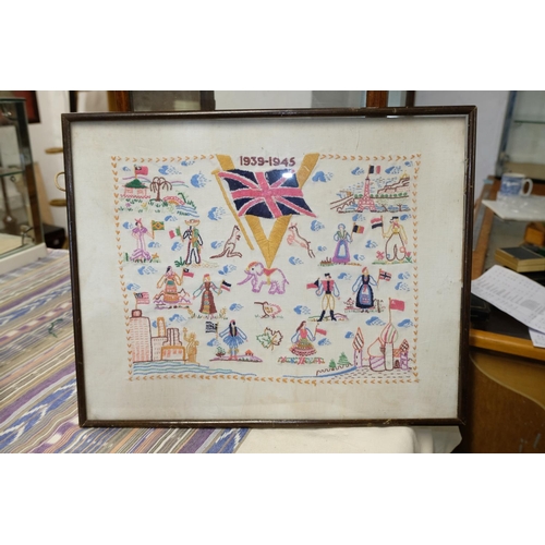 267 - Two commemorative needlework pictures, measuring 36cm x 27cm and 36cm x 46cm.