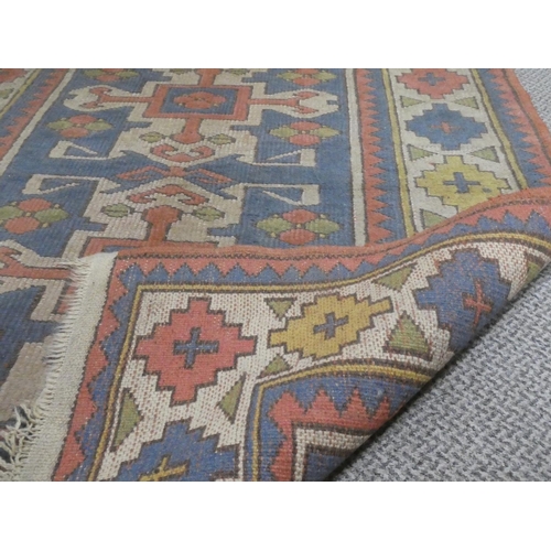 1 - A decorative rug, measuring 165cm x 115cm.