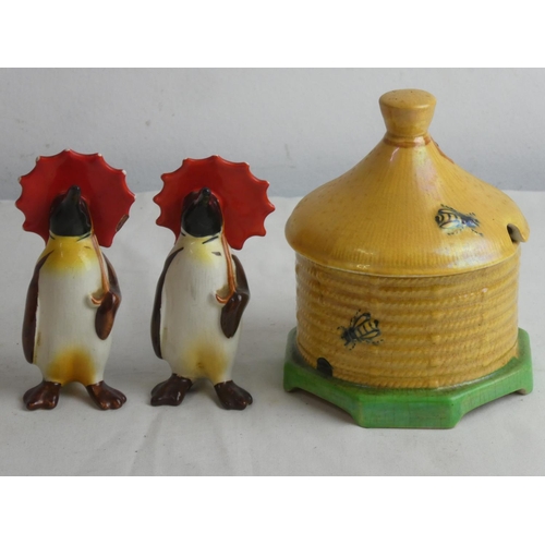 63 - A vintage Carlton Ware honey pot and a pair of Beswick penguins (a/f).