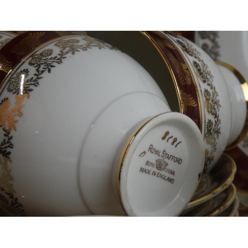 65 - A large Royal Stafford bone china tea set including two cake plates.