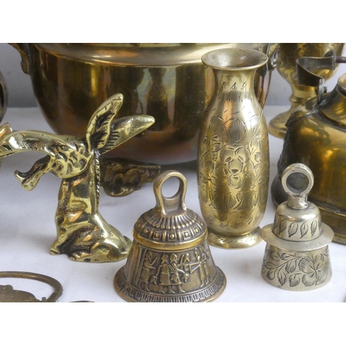 78 - A vintage footed brass plant pot, an ornament of a donkey and other brass ware.