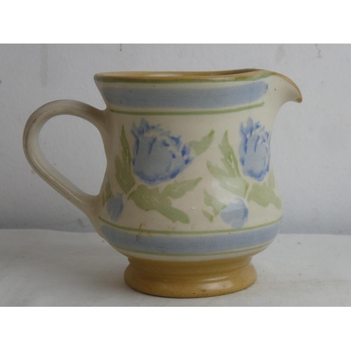 86 - A Nicholas Mosse pottery jug, measuring 4