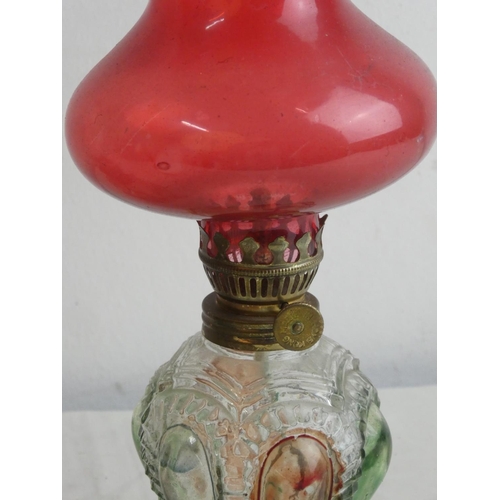 88 - A multi-coloured glass finger lamp and another oil lamp.