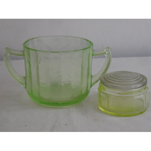 123 - A decorative antique Uranium glass twin handled cup & trinket box.