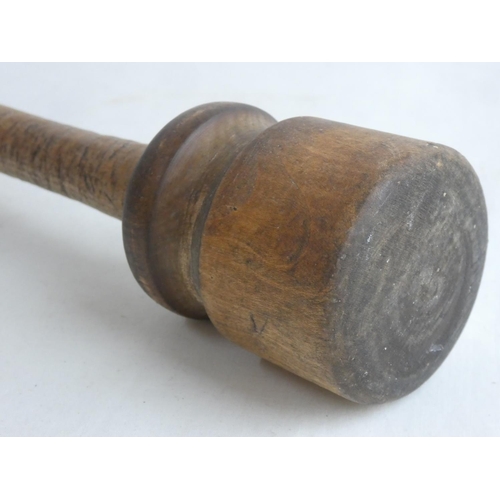 130 - An antique wooden potato masher.