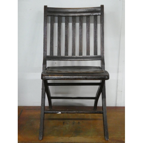 150 - An antique folding chair.