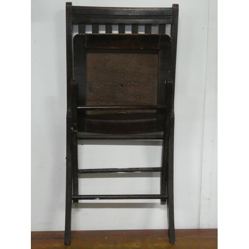 150 - An antique folding chair.