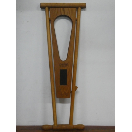 151 - A Cloakrooms folding boot jack, measuring 36