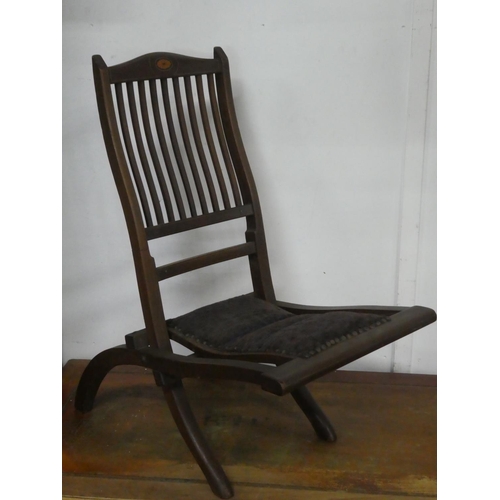 152 - An antique folding chair.