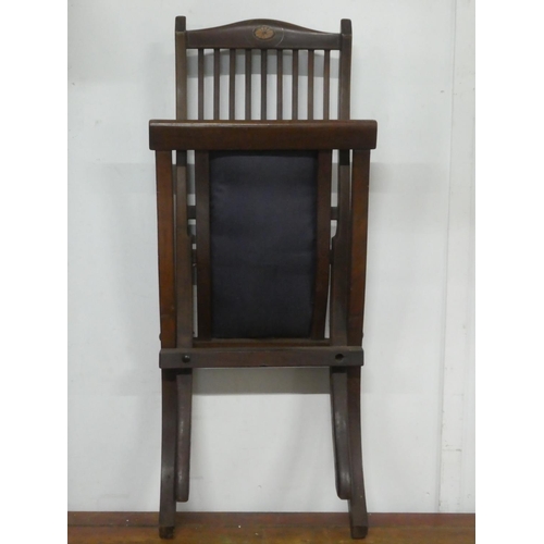 152 - An antique folding chair.