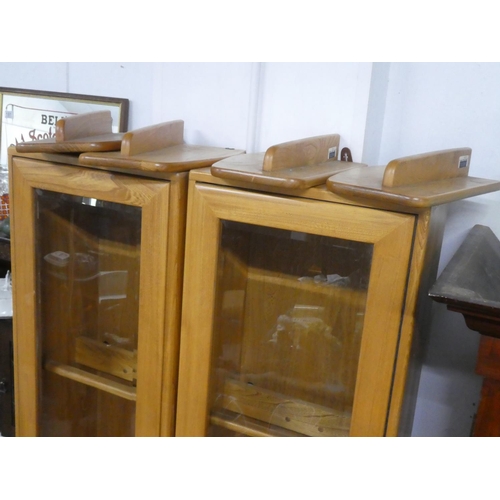 155 - A pair of vintage Ercol Windsor display cabinets with adjustable modular shelving.