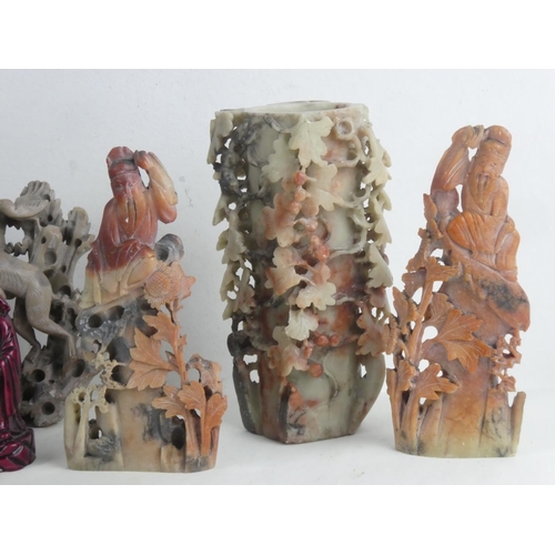 169 - A stunning collection of carved soapstone pieces.