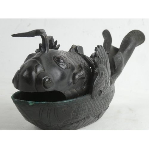 178 - A rare Chinese bronze incense burner in the style of a fish, measuring 27cm w x 10cm h.