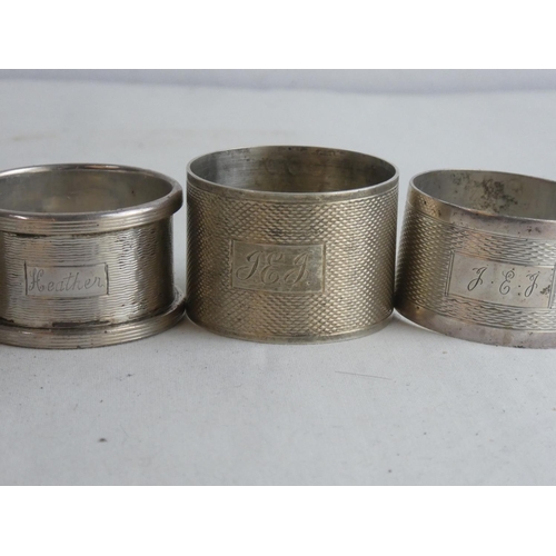 184 - Five Sterling silver napkin rings, weighing 137g.