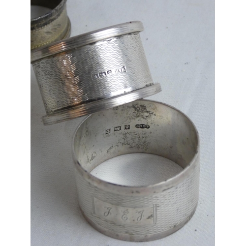 184 - Five Sterling silver napkin rings, weighing 137g.