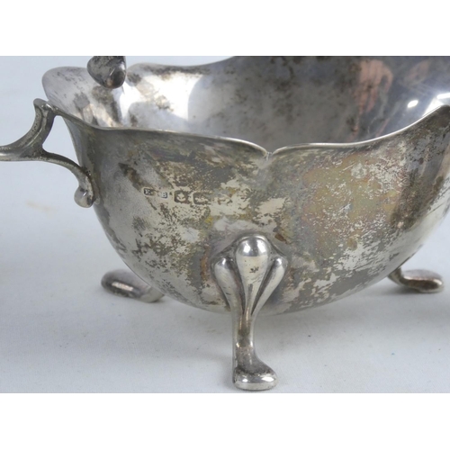 192 - A Sterling silver sauceboat and a Sterling silver salt pot by maker John H Lunn Limited, Belfast, we... 