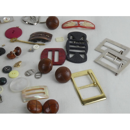 200 - A collection of vintage buckles and buttons etc.