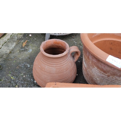 62 - An assortment of terracotta pots, two buckets and a hanging basket.