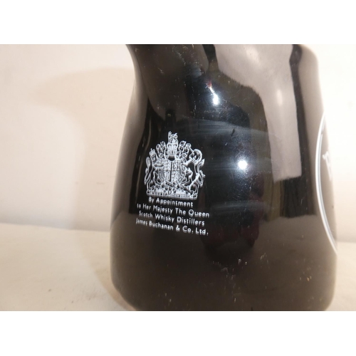 264 - A vintage Black & White whiskey jug.