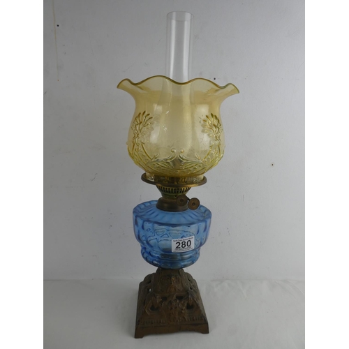 280 - A stunning antique blue glass font cottage oil lamp with Uranium glass shade.