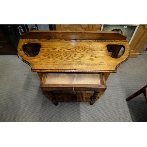 561 - An oak hall table with barley twist detail.