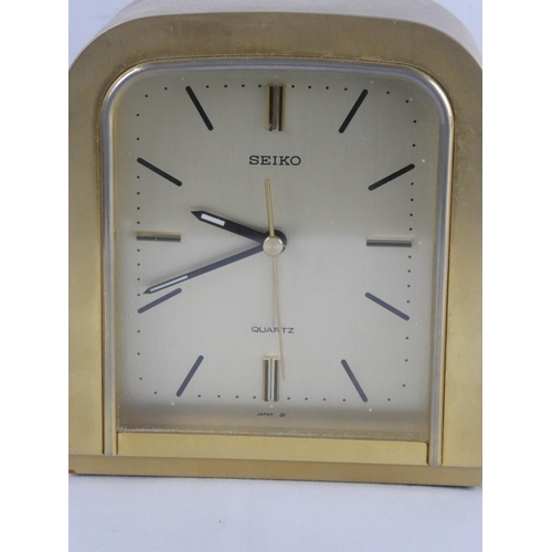 291 - A vintage brass cased Seiko alarm clock & more.