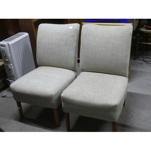 292 - A pair of upholstered chairs.