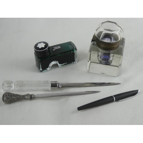 186 - A vintage glass inkwell, a bottle of Mont Blanc ink and a Cross pen & 2 letter openers.