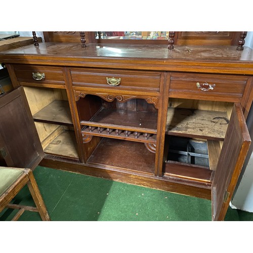 205 - An antique mahogany sideboard with mirror back.