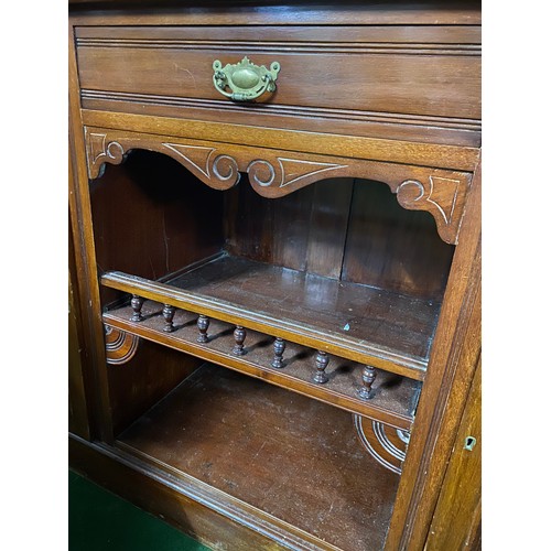 205 - An antique mahogany sideboard with mirror back.