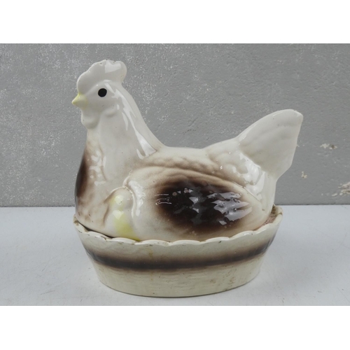 63 - A vintage hen on nest egg basket.