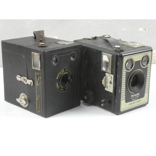 84 - A vintage boxed Six 20 Brownie Model D camera and another Popular Brownie.