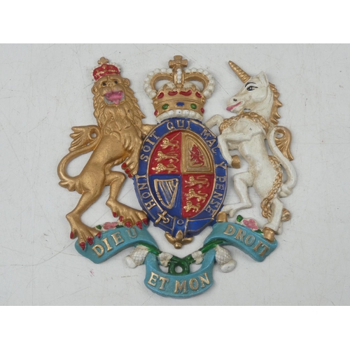 128 - A reproduction cast metal Royal crest, measuring 26cm x 24cm.