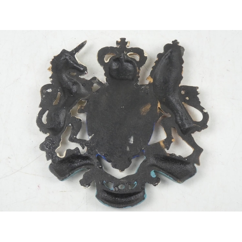 128 - A reproduction cast metal Royal crest, measuring 26cm x 24cm.