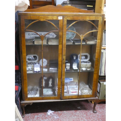 130 - A vintage china display cabinet with two glass shelves.