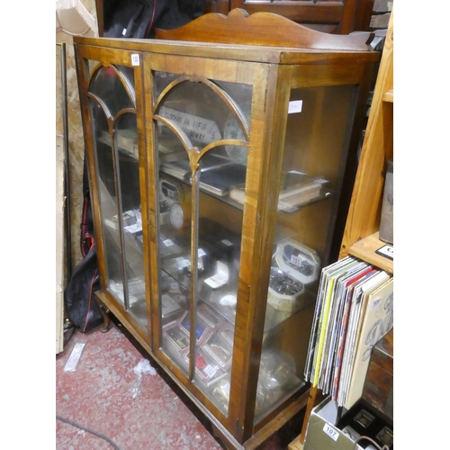 130 - A vintage china display cabinet with two glass shelves.